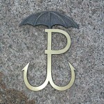 Odznaka Parasola na płycie nagrobka